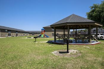 Sitting area with picnic tables and bbq grill